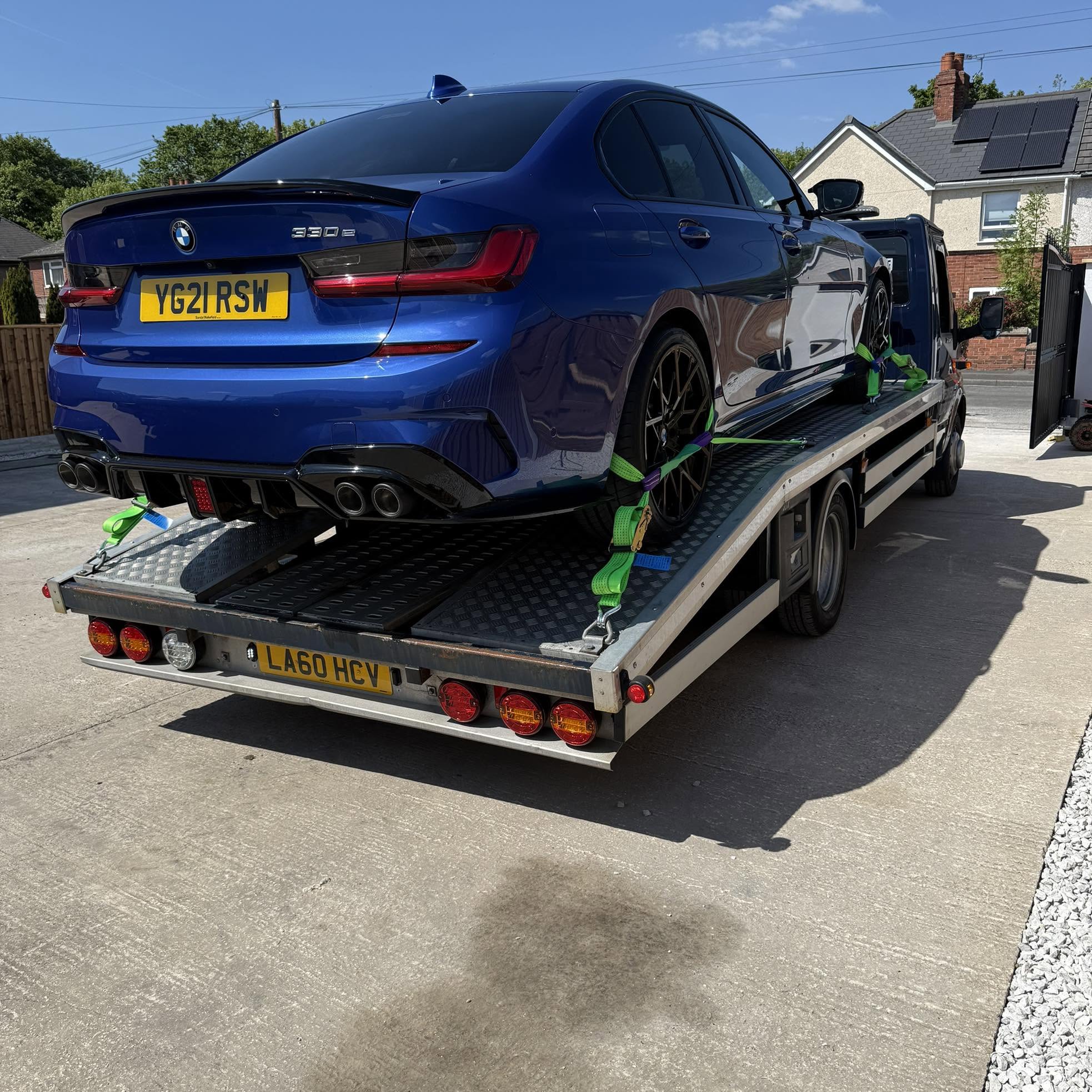 A car being lifted during a recovery job
